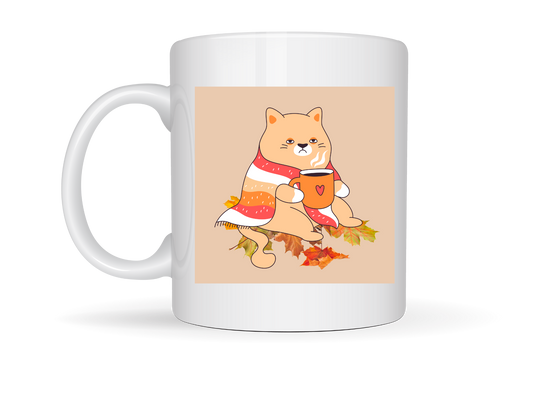 “White ceramic mug with a cartoon cat in a scarf holding a warm drink on one side, and ‘AUTUMN MOOD’ text with fall leaves on the other.”