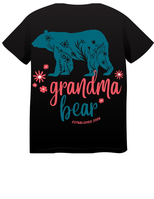 “Teal bear with floral patterns and pink flowers, text reads ‘Grandma Bear EST. 2009’ in playful script on shirt and hoodie.”