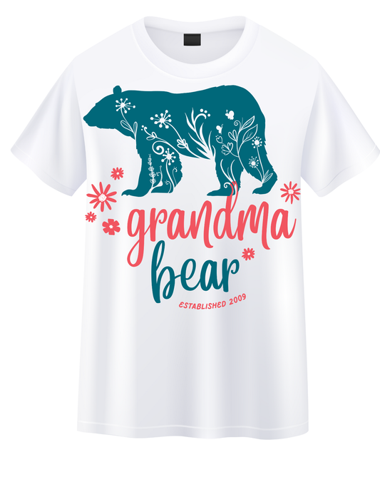 “Teal bear with floral patterns and pink flowers, text reads ‘Grandma Bear EST. 2009’ in playful script on shirt and hoodie.”